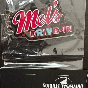 Halloween Horror Nights 2025 Mel's Die-In Acrylic Keychain
